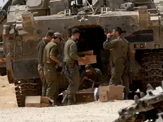 epa11312275 Israeli soldiers check military equipment as they gather at a position on the southern Israeli border with the Gaza Strip, near the Palestinian city of Rafah, 01 May 2024. More than 34,300 Palestinians and over 1,455 Israelis have been killed, according to the Palestinian Health Ministry and the Israel Defense Forces (IDF), since Hamas militants launched an attack against Israel from the Gaza Strip on 07 October 2023, and the Israeli operations in Gaza and the West Bank which followed it. EPA/ATEF SAFADI