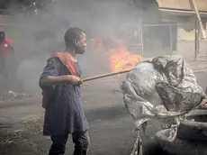 epa11138166 People demonstrate during a protest in Petion-Ville, Haiti, 08 February 2024. The capital of Haiti and several provincial cities are in apparent calm after intense and massive anti-government demonstrations demanding the resignation of Prime Minister Ariel Henry on 07 February, which left six dead. EPA/Johnson Sabin