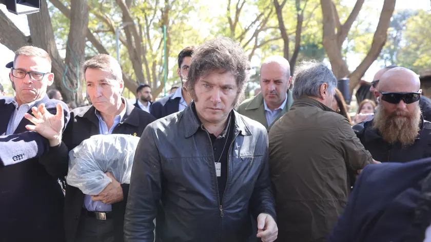 epa11136506 Argentinian President Javier Milei (C) leaves after visiting kibbutz Nir Oz, one of the sites of the October 2023 attack by Hamas, near border with the Gaza Strip, southern Israel, 08 February 2024. EPA/ABIR SULTAN