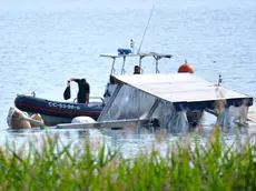 The 'Goduria', the tourist boat on which 007 Italians and Israelis were travelling, shipwrecked the day before last evening in Lisanza (Varese), in the waters of Lake Maggiore, which has not yet been washed ashore, Sesto Calende, near Varese, Italy, 30 May 2023. Two days of recovery operations have gone bankrupt, despite the help of special compressed air balloons, which were supposed to allow the wreck to rise to the surface, and then drag it to shore. Yesterday, after getting stranded, the boat was blocked while today, after a new attempt, Tomorrow, if the third round of work by the Fire Brigade specialists should prove to be in vain, the use of a particular crane will be evaluated. The Fire Brigade will be able to carry out a test. ANSA / PURICELLI La 'Goduria', l'imbarcazione turistica a bordo della quale viaggiavano 007 italiani ed israeliani, naufragata l'altro ieri sera a Lisanza (Varese), nelle acque del Lago Maggiore, che non è stata ancora trascinata a riva, Sesto Calende (Varese), 30 maggio 2023 . Due giorni di operazioni di recupero sono andate fallite, nonostante l'ausilio di particolari palloni ad aria compressa, che avrebbero dovuto permettere la risalita del relitto in superficie, per poi trascinarlo verso riva. Ieri, dopo essersi incagliata, l'imbarcazione è rimasta bloccata mentre oggi, dopo un nuovo tentativo, è risprofondata di qualche metro. Domani, qualora il terzo round di lavoro da parte degli specialisti dei Vigili del Fuoco dovesse risultare vano, verrà valutato l'utilizzo di una particolare gru. ANSA / PURICELLI