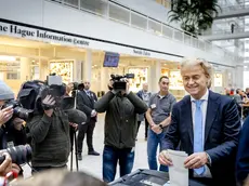epa10988938 Party for Freedom (PVV) leader Geert Wilders (R) casts his vote in the House of Representatives elections at a polling station in The Hague, The Netherlands, 22 November 2023. Dutch voters are heading to the polls on 22 November to elect the members of the House of Representatives and a new prime minister, after Netherlands' longest-serving prime minister, Mark Rutte's cabinet collapsed in July. EPA/REMKO DE WAAL