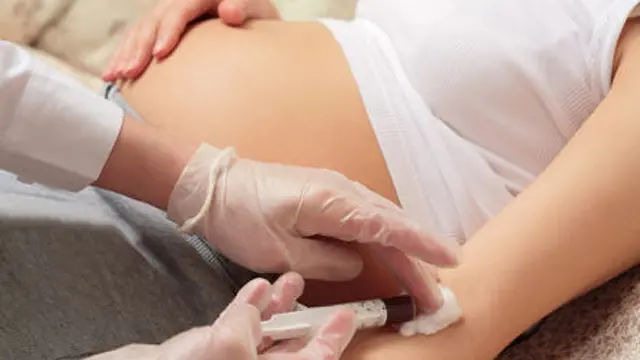 hands of the doctor with syringe, pregnancy, control blood in a laboratory