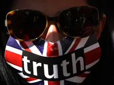 epa11355075 A supporter has their mouth taped with a flier reading 'truth' outside the High Court during WikiLeaks' founder Julian Assange's extradition appeal hearing in London, Britain, 20 May 2024. Julian Assange is facing his final extradition hearing at London's High Court on 20 May. Two judges have said that unless assurances are given by the US he would be able to bring an appeal on three grounds. In April 2024 the US provided assurances to the court that Assange would not face death penalty and could rely on the First Amendment right to free speech, and a follow up hearing will now take place for approximately two hours. Assange is facing 175 years in a US prison if the hearing goes against him. EPA/NEIL HALL