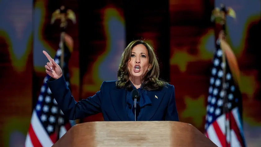 epa11561025 Democratic presidential nominee and US Vice President Kamala Harris speaks during the final night of the Democratic National Convention (DNC) at the United Center in Chicago, Illinois, USA, 22 August, 2024. The 2024 Democratic National Convention is being held from 19 to 22 August 2024, during which delegates of the United States' Democratic Party will vote on the party's platform and ceremonially vote for the party's nominee for president, Vice President Kamala Harris, and for vice president, Governor Tim Walz of Minnesota, for the upcoming presidential election. EPA/WILL OLIVER