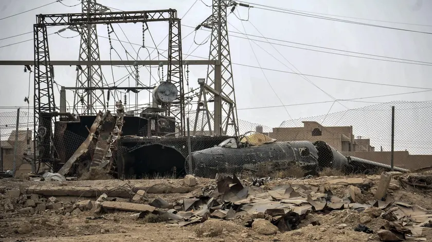 epa06346936 An undated handout photo made available on 23 November 2017 by the Syriaâs Arab News Agency (SANA) showing remains of a warplane in the vicinity of Al-Boukamal city in the countryside of Deir Ezzor, Syria. According to SANA Russian strategic bombers destroyed on 17 November command sites, gatherings, and armored vehicles for Daesh (ISIS) terrorist organization in the vicinity of al-Boukamal city in the countryside of Deir Ezzor. The Russian Defense Ministry said in a statement that on November 17th 2017, six Tupolev-22M3 long-range bombers left an airbase in Russia, crossed Iranian and Iraqi airspace, and carried out a massive airstrike against facilities of the terrorist organization Daesh near Abu Kamal, in Syriaâs Deir Ezzor province, and the targets included strongholds, manpower, and armored vehicles. EPA/SANA / HANDOUT HANDOUT EDITORIAL USE ONLY/NO SALES