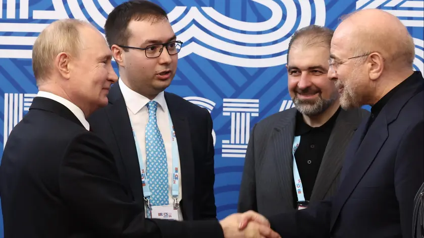 epa11472615 Speaker of the Federation Council Valentina Matviyenko (L), Russian President Vladimir Putin (L) shakes hands with Speaker of the Islamic Consultative Assembly of Iran Mohammad Bagher Ghalibaf (R) during their meeting on the sidelines of the 10th BRICS Parliamentary Forum in St.Petersburg, Russia, 11 July 2024. BRICS is an intergovernmental association of Brazil, the Russian Federation, the Republic of India, the People's Republic of China and the Republic of South Africa. EPA/VALERIY SHARIFULIN / SPUTNIK / KREMLIN POOL MANDATORY CREDIT