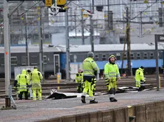 epa11174374 Emergency services clear a platform of debris as train departures in the region have been canceled and all tracks at Gothenburg's central station are without power after a piece of roof was blown off and obstructed power lines, Gothenburg, Sweden, 23 February 2024. Stormy weather has moved in over western Sweden and the Swedish Meteorological and Hydrological Institute has issued several warnings for further strong winds this weekend. EPA/Björn Larsson Rosvall/TT SWEDEN OUT