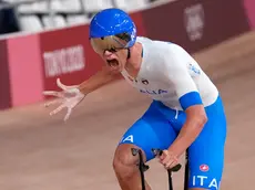 Jonathan Milan of Team Italy celebrates after winning the gold medal and setting a world record during the track cycling men's team pursuit at the 2020 Summer Olympics, Wednesday, Aug. 4, 2021, in Izu, Japan. (AP Photo/Christophe Ena)