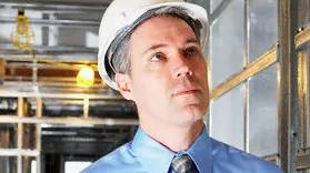 Man at Construction Site --- Image by © Artiga Photo/Corbis