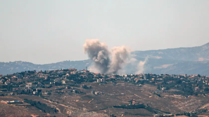 epa11436621 Smoke rises as a result of an Israeli air strike in the southern Lebanese town of Khiam, as seen from Snir, northern Israel, 25 June 2024. According to an Israeli army report, the IDF Aerial Defense Array successfully intercepted a suspicious aerial target that crossed from Lebanon, and Israeli fighter jets struck Hezbollah military structures in the areas of Khiam and Odaisseh in southern Lebanon on 25 June. EPA/ATEF SAFADI