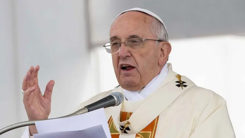 Pope Francis delivers his message during an open-air mass in front of the Italy’s largest war memorial, in Fogliano Redipuglia, northern Italy, Saturday, Sept. 13, 2014. Pope Francis has urged the world to shed its apathy in the face of what he sees as a third world war, intoning "war is madness" during a homily at the foot of a Fascist-era World War I monument near the Slovene border. (AP Photo/Paolo Giovannini)