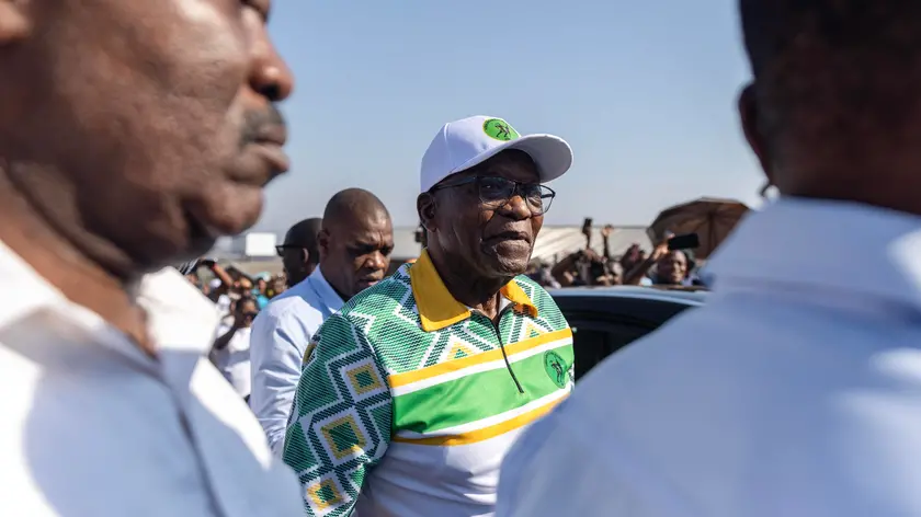 epa11377122 Former South African President Jacob Zuma (C) leaves a voting station after casting his vote during the South African general election in Nkandla, northern KwaZulu-Natal province, South Africa, 29 May 2024. Over 27 million citizens are registered to vote in the national and provincial elections to elect a new National Assembly and state legislatures, according to the Electoral Commission of South Africa. South Africans do not directly vote for the president. They vote for parties that will appoint 400 representatives to the National Assembly who will then choose the president for the next five years. EPA/SANDILE NDLOVU