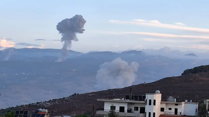 epa11620193 Smoke billows from the site of Israeli airstrikes that targeted Lebanese villages, as seen from Marjaayoun, southern Lebanon, early 23 September 2024. According to the Lebanese National News Agency (NNA), Israeli aircraft have reportedly carried out a number of bombings on communities in the Marjayoun district in the Nabatieh Governorate of Lebanon, including Taybeh, Houla, Tallouseh, Kfarkela, Mays al-Jabal, Khiyam, and Bani Hayan. The Israeli military urged, on 23 September 2024, civilians in areas where Hezbollah operates in Lebanon to leave, saying that they are conducting 'extensive airstrikes.' EPA/STR