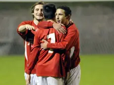 San Daniele 14 novembre 2012. Calcio. San Daniele - Lignano. Il n. 7 del San Daniele in azione e festeggiato da i compagni dopo il primo gol. Telefoto copyright Petrussi Foto Press- / Mattia Serratore