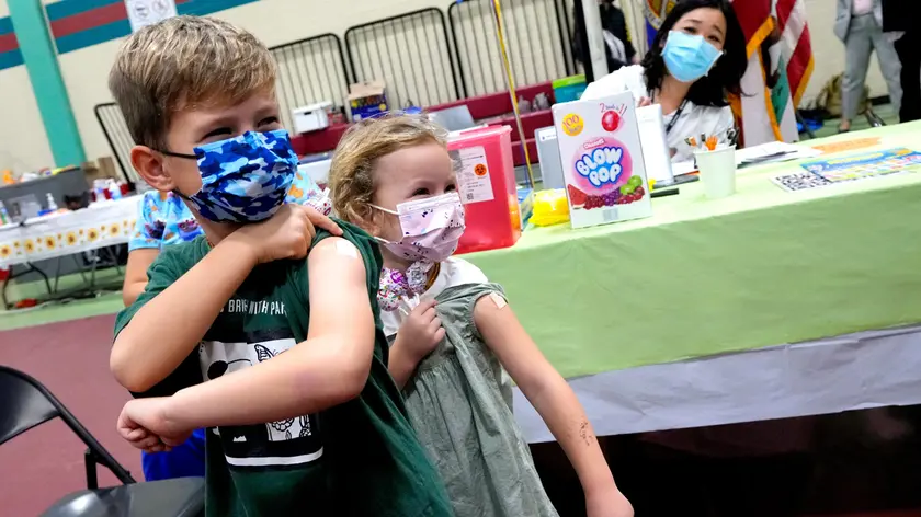 Wren Nagata, 7, with his sister 5-year-old Mallory Nagata, of Pasadena, show off their bandaids after receiving their COVID-19 vaccines during an event kicking off coronavirus vaccinations for children age 5-11 at Eugene A. Obregon Park in Los Angeles on Wednesday, Nov. 3, 2021. (Keith Birmingham/The Orange County Register via AP)