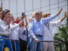 epa11510534 Venezuelan opposition leader Maria Corina Machado (L) and Venezuelan presidential candidate Edmundo Gonzalez Urrutia (R) participate in a rally in Caracas, Venezuela, 30 July 2024. Thousands of Venezuelans gathered in Caracas on 30 July in an event called by the majority opposition, to reject for the second consecutive day what they consider to be fraud in the official results of the National Electoral Council (CNE), which proclaimed Nicolas Maduro as re-elected president with 51.2 percent of the votes. EPA/HENRY CHIRINOS