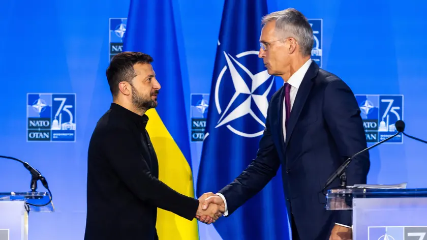 epa11473082 President of Ukraine Volodymyr Zelensky (L) shakes hands with NATO Secretary General Jens Stoltenberg (R) after the two held a press conference at the 2024 North Atlantic Treaty Organization (NATO) conference in Washington, DC, USA, 11 July 2024. NATO members are using the gathering as an opportunity to project their ongoing support for Ukraine as the country continues to fend off Russian aggression. EPA/JIM LO SCALZO