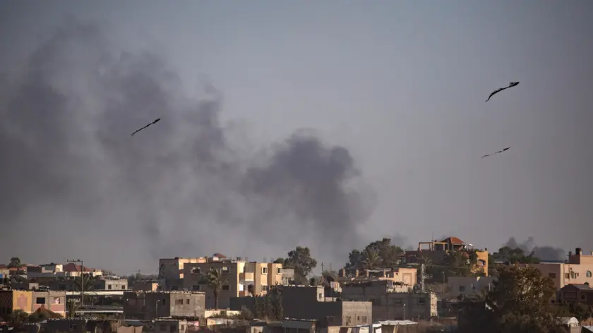 epa11367086 Smoke rises after an Israeli airstrike in Rafah, southern Gaza Strip, 24 May 2024. The International Court of Justice (ICJ) on 24 May ordered Israel to halt its military operation in Rafah, to open the Rafah border crossing with Egypt to allow for the entry of humanitarian aid, to allow access to Gaza for investigators, and to report to the court within one month on its progress. More than 35,000 Palestinians and over 1,400 Israelis have been killed, according to the Palestinian Health Ministry and the Israel Defense Forces (IDF), since Hamas militants launched an attack against Israel from the Gaza Strip on 07 October 2023, and the Israeli operations in Gaza and the West Bank which followed it. EPA/HAITHAM IMAD