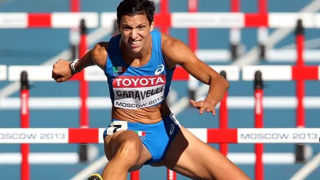 epa03826427 Italy's Marzia Caravelli competes in the women's 100m Hurdles heats at the 14th IAAF World Championships at Luzhniki stadium in Moscow, Russia, 16 August 2013. EPA/SERGEI ILNITSKY