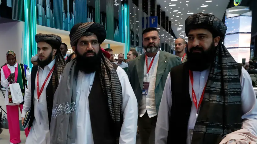 epa11393598 Members of Afghanistan's delegation, led by the Taliban-run government's Acting Labour and Social Affairs Minister Abdul Hanan Omari walk at the venue of the St. Petersburg International Economic Forum (SPIEF) in St. Petersburg, Russia, 06 June 2024. The 27th St.Petersburg International Economic Forum takes place in St. Petersburg from 05 until 08 June 2024. EPA/ANATOLY MALTSEV
