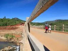 epa08293196 Youths walk along one rebuilt bridge one yaer after it was destroyed by Cyclone Idai in Chimanimani, Zimbabwe, 13 March 2020. Cylone Idai made landfall in Mozambique on 14 March and subsequently moved on to Malawi and Zimbabwe where it caimed at least 634 lives. Rebuilding of roads and bridges destroyed by cyclone Idai is still ongoing. Families whose homes were destroyed by the cyclone are still living in tents as the goverment is delaying in finding them alternative accomodation. EPA/AARON UFUMELI